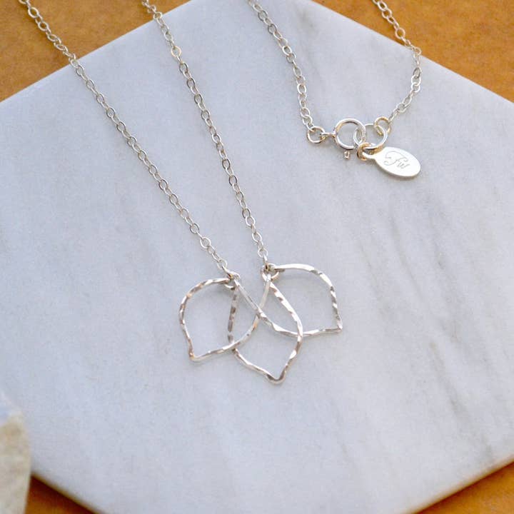 Lotus Necklace - lotus blossom silhouette pendant necklace for wholesale by Foamy Wader