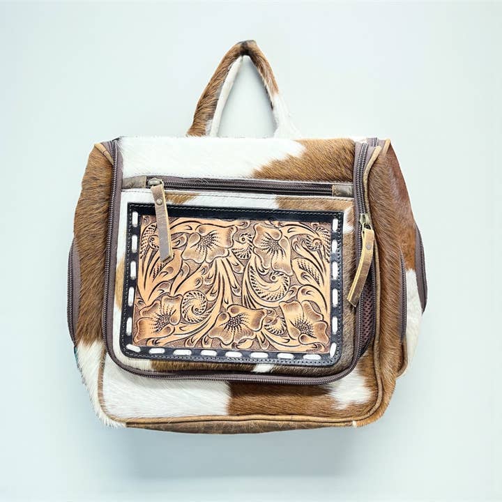 Tooled leather & cowhide hanging toiletry bag for wholesale by Western Linens