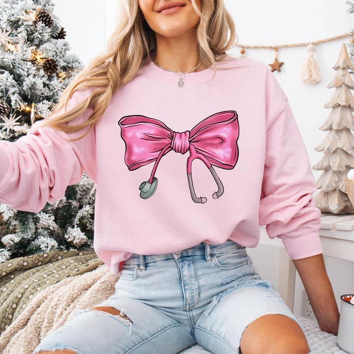 NVC Ecommerce LLC - Wholesale T-Shirt (Graphic) - Women's - Coquette Nurse Stethoscope Bow Sweatshirt, Xmas Shirt