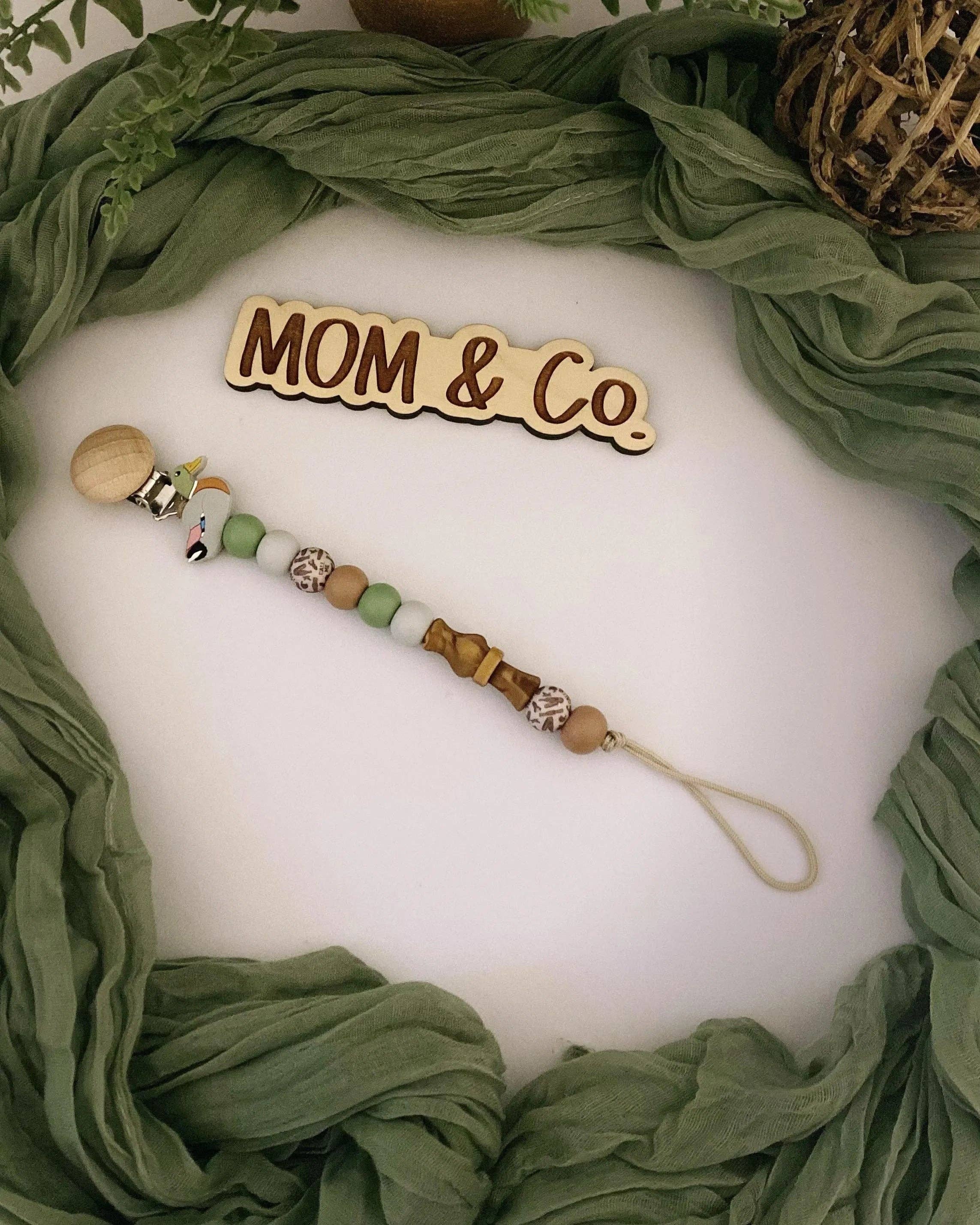 Mom & Co. - Vendita all'ingrosso Molletta per ciuccio - Neonati - Clip per ciuccio con richiamo per anatra germano reale