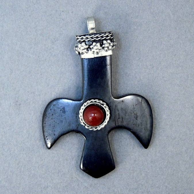 Tibetan Cross Pendant-- Black Wooden Dove Shaped Cross Pendant with Silver Tone Cap and Red Gemstone Accent - Handmade in Nepal (S59B1-02) for wholesale by Jewelers Paradise