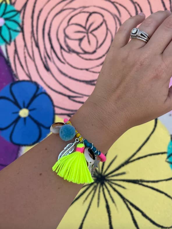 Charmed & Tasseled Stretch Bracelets for wholesale by Briano Wholesale