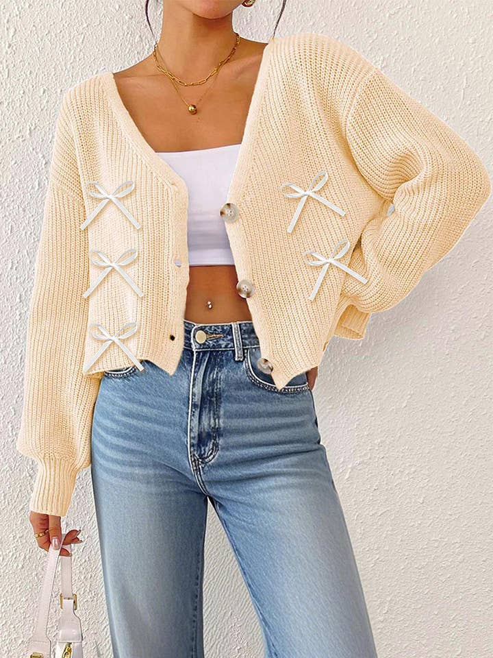 Suéter con lazo decorativo de cinta y escote en V profundo con tres botones OYM206 para venta al por mayor de UNISHE