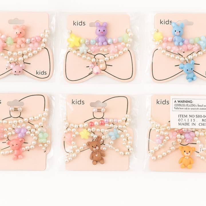 Majestic Wholesale - Wholesale Jewellery set - Kids Pearl Necklace Set – Cute Bear & Flower Charms 12CT0