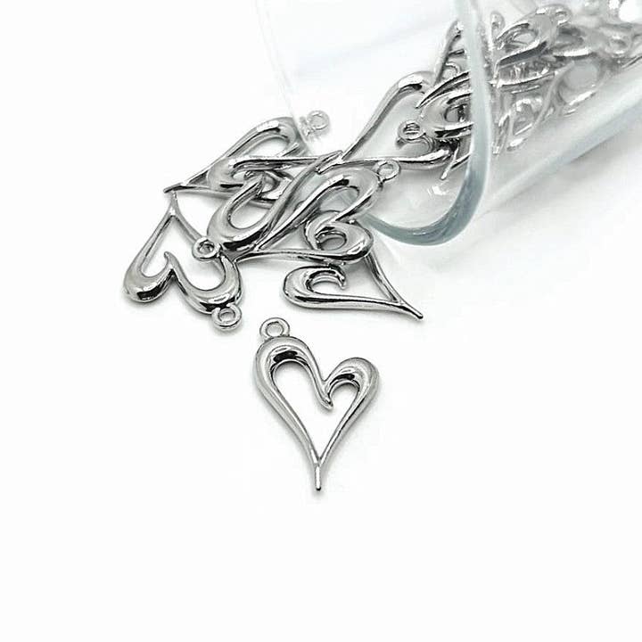 Silver Asymmetrical Heart Charms, 24x15mm for wholesale by Guerrilla Charm