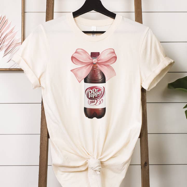 Diet Dr Pepper Soda Coquette Pink Bow Bottle Graphic Tee for wholesale by Par.tees by Party On!