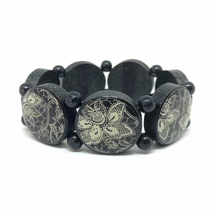 “Round Wood Bracelet With Silver Pigments And Black for wholesale by Escapulario