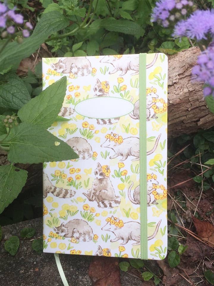 Raccoon & Possum's Midsummer Fête Hardcover Notebook for wholesale by Cottonbook