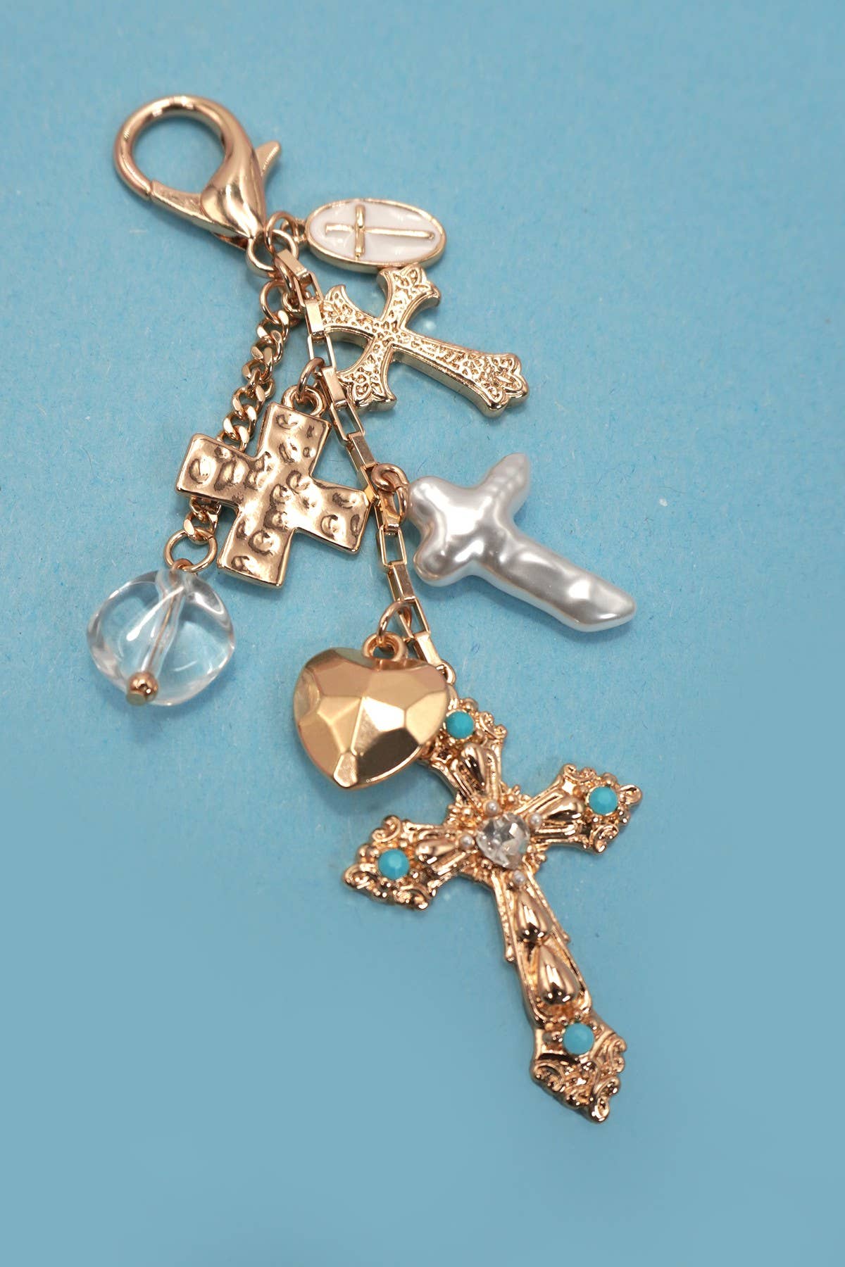 Gold BAG CHARM- WESTERN HEART PEARLIZED CROSS | 80K040 for wholesale on Faire1