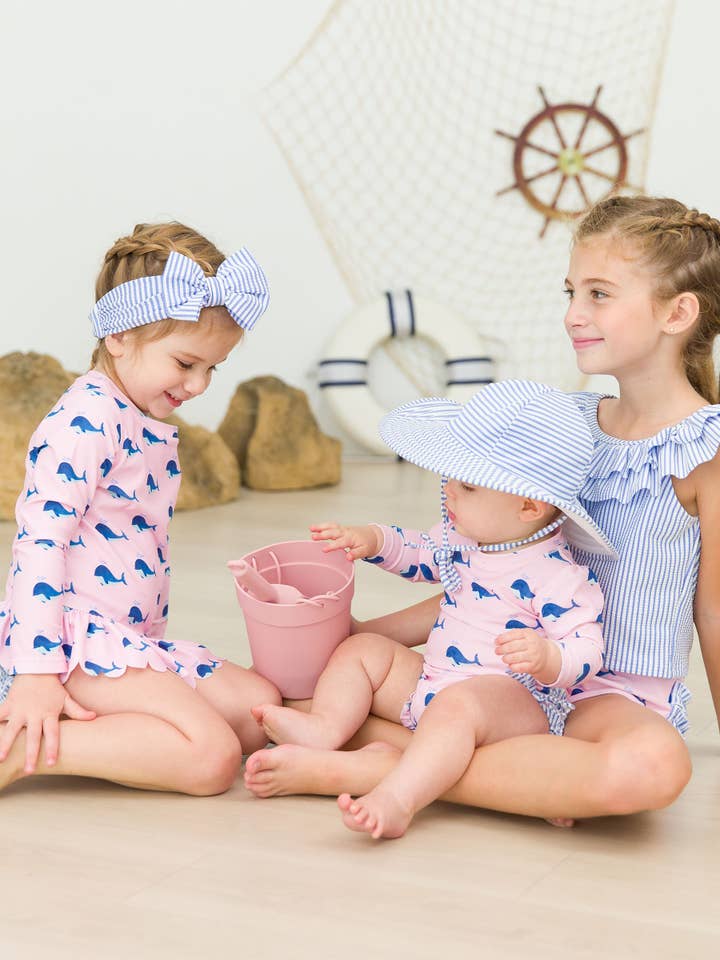 Baby Girls Pink Whale Friends Long Sleeve One Piece Rash Guard Swimsuit with Signature Rear Ruffles
for wholesale on Faire