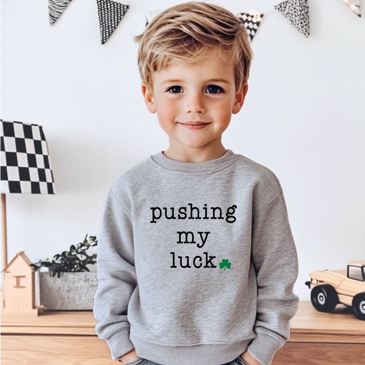 Pushing My Luck, Funny Kids St. Patrick's Day Sweatshirt for wholesale by Bump & Beyond Designs