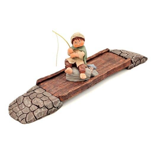 Ponte con pescatore per la vendita all'ingrosso da parte di Cuqui