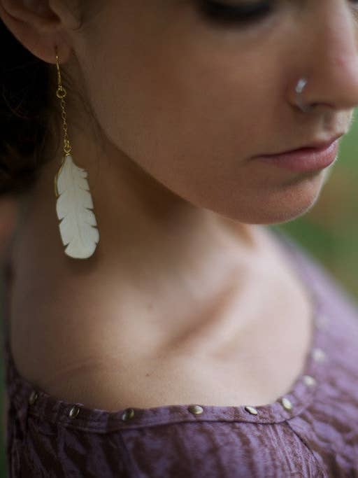 Carved bone earring of a owl feather for wholesale by sundaricreations