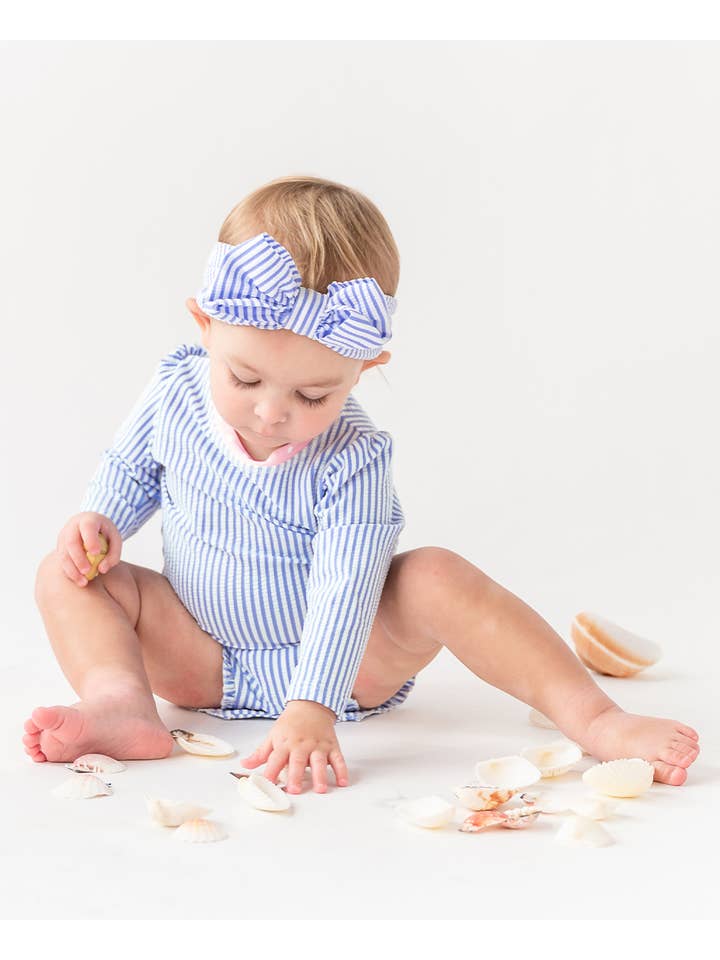 RuffleButts + RuggedButts - Wholesale Rashguard - Baby - Baby Girls Periwinkle Blue Seersucker Long Sleeve One Piece Rash Guard Swimsuit with Signature Rear Ruffles
4