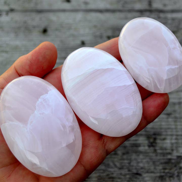 Pink Mangano Calcite Palm Stone (55mm - 90mm) for wholesale by Kaia & Crystals