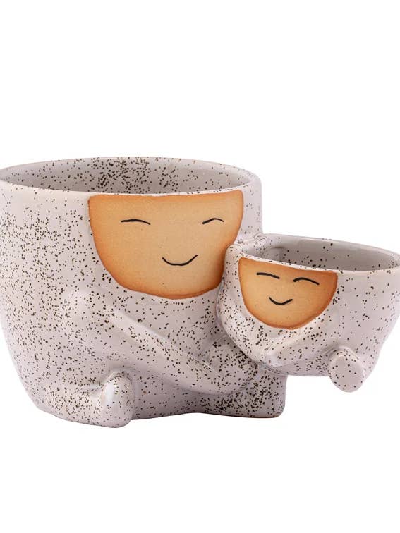 Smiling Hugging Planter Holding Baby Planter Item #22605 for wholesale by Napco