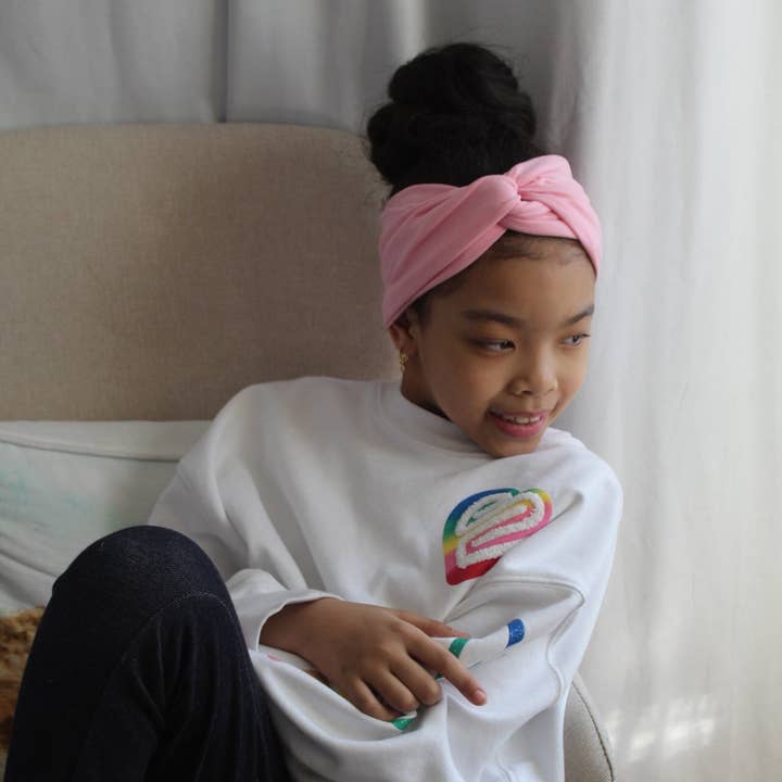 Kids Powder Pink Twisted Turban Headband for wholesale by The Enchanted Magnolia