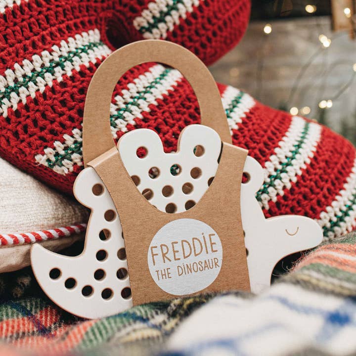 Freddie the Dinosaur, wooden lacing toy, montessori for wholesale by milin