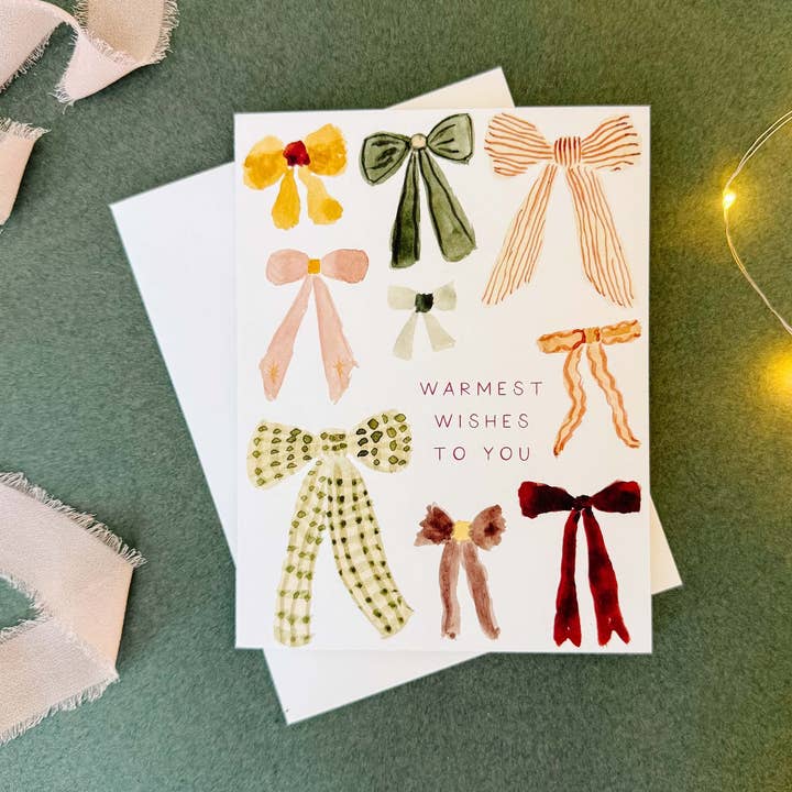 Carte de Vœux "Chaleureux Souhaits" avec Nœuds Aquarelle de Fêtes pour la vente par Whitney Rain Studio