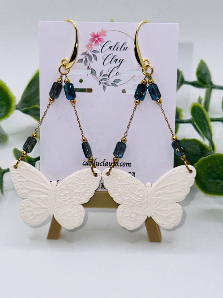 Long White and Gold Butterfly Dangles for wholesale by CaliLu Clay Co.