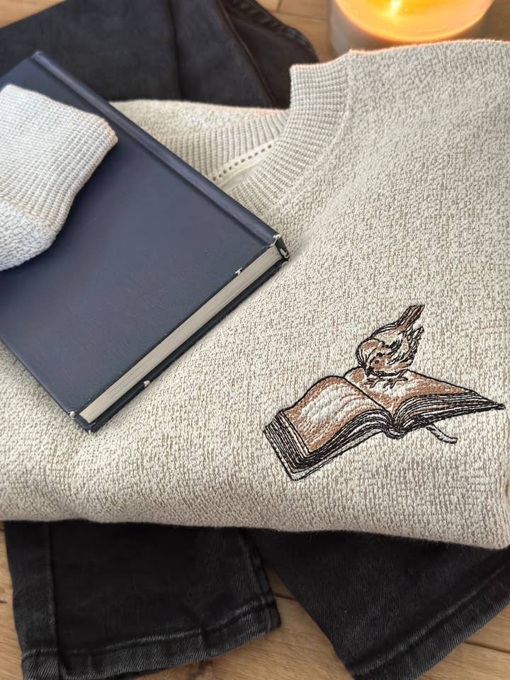 Beige Book themed Crewneck Sweater, Bird and Book Embroidery for wholesale on Faire