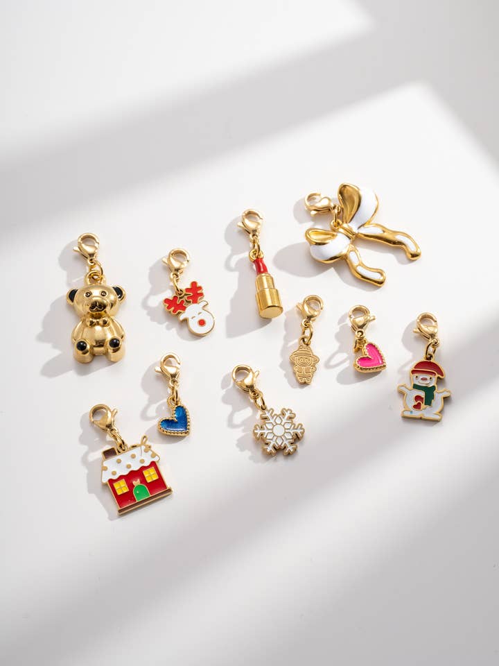 Set of 10 colorful gold stainless steel festive pendants for wholesale by COSMOS