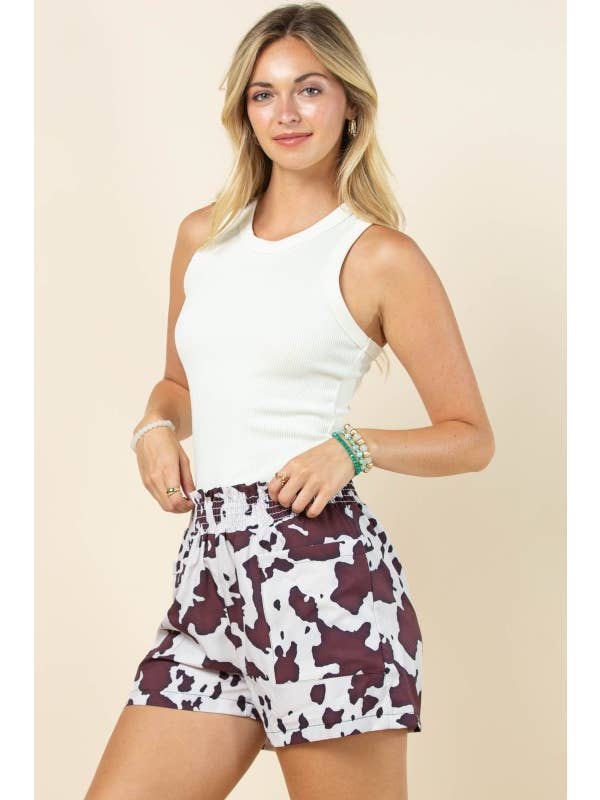 Brown Cream AP1312-MARGOT COW PRINT SMOCK ELASTIC WAIST WOVEN SHORTS for wholesale on Faire8