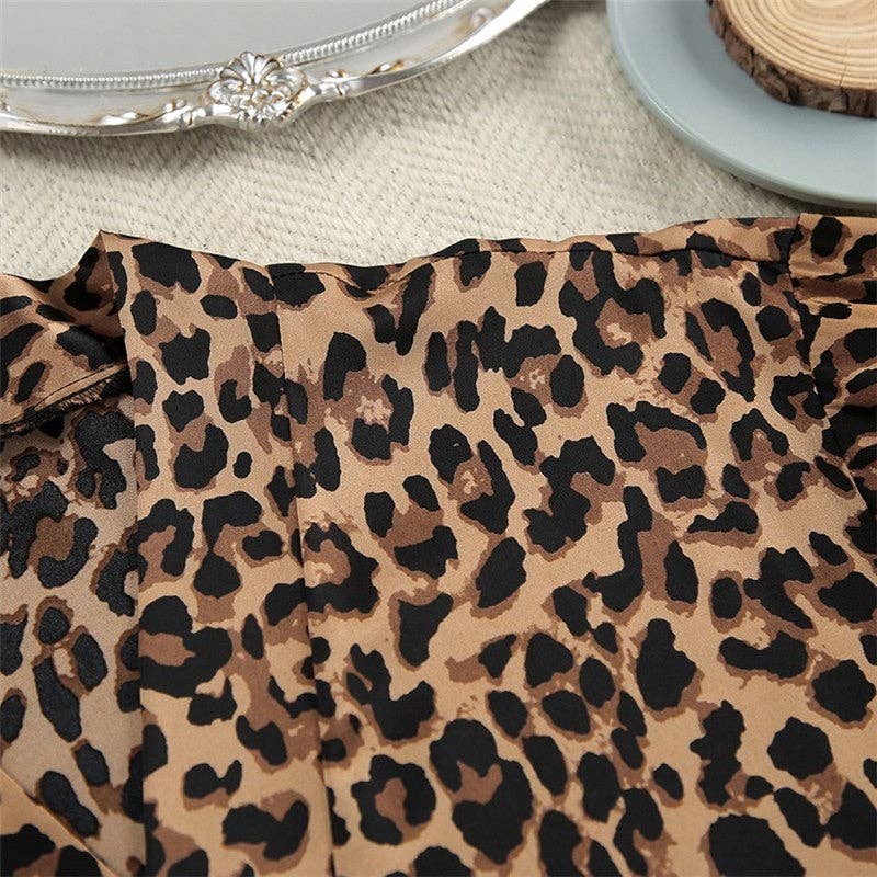 LEOPARDO Abito lungo con scollo a V patchwork in piume con stampa leopardata in vendita all'ingrosso su Faire7