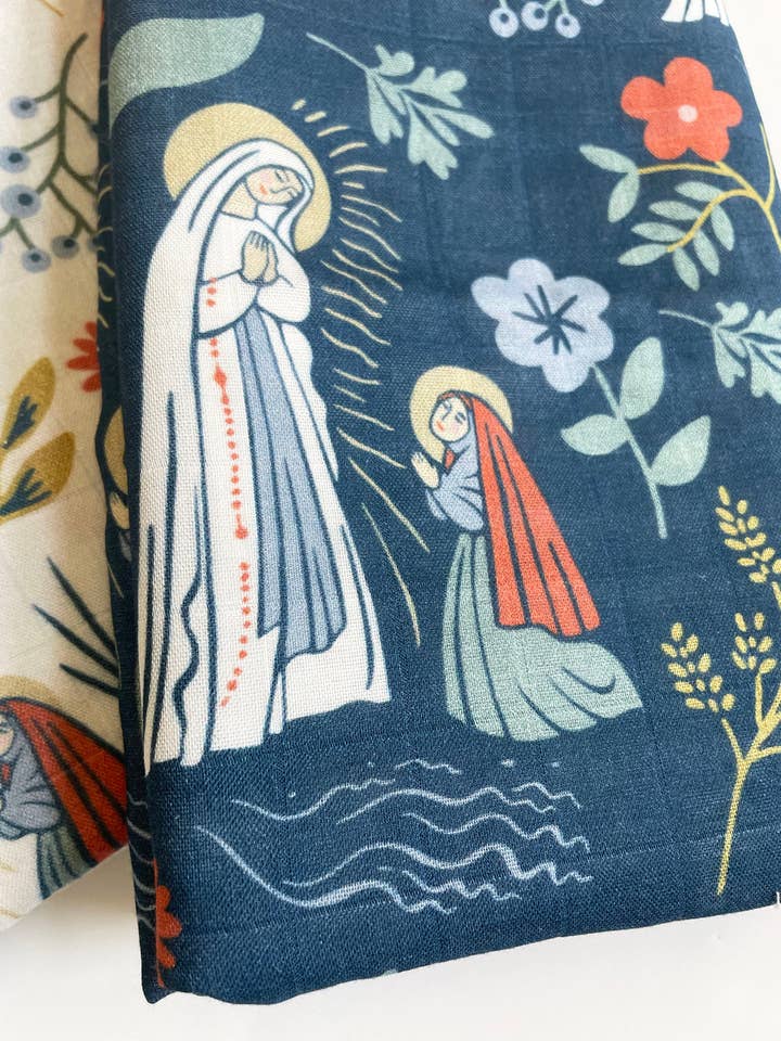 The Stump of Jesse - Wholesale Swaddle - Baby - Our Lady of Lourdes & St. Bernadette Deluxe Swaddle Catholic