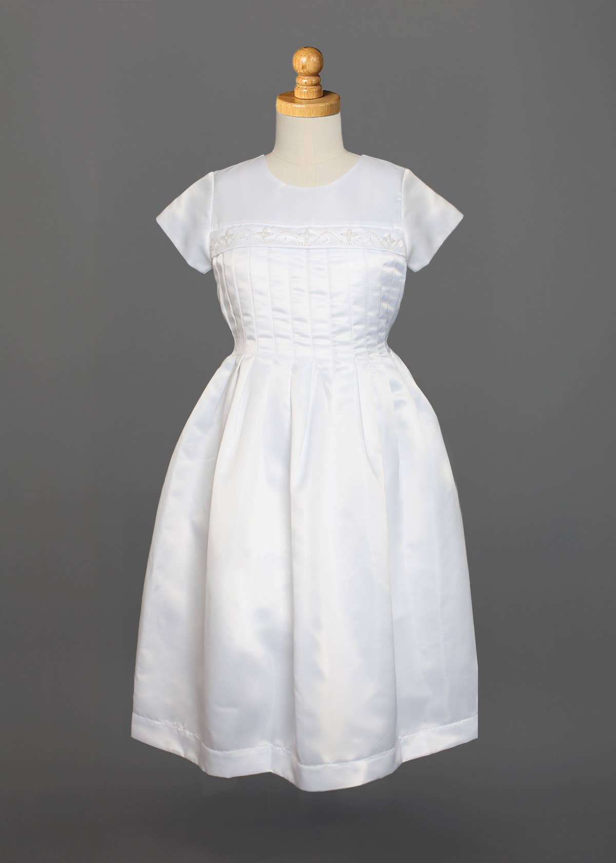 White Taffeta Pleated Communion Dress with Beaded Cross Detail for wholesale on Faire2
