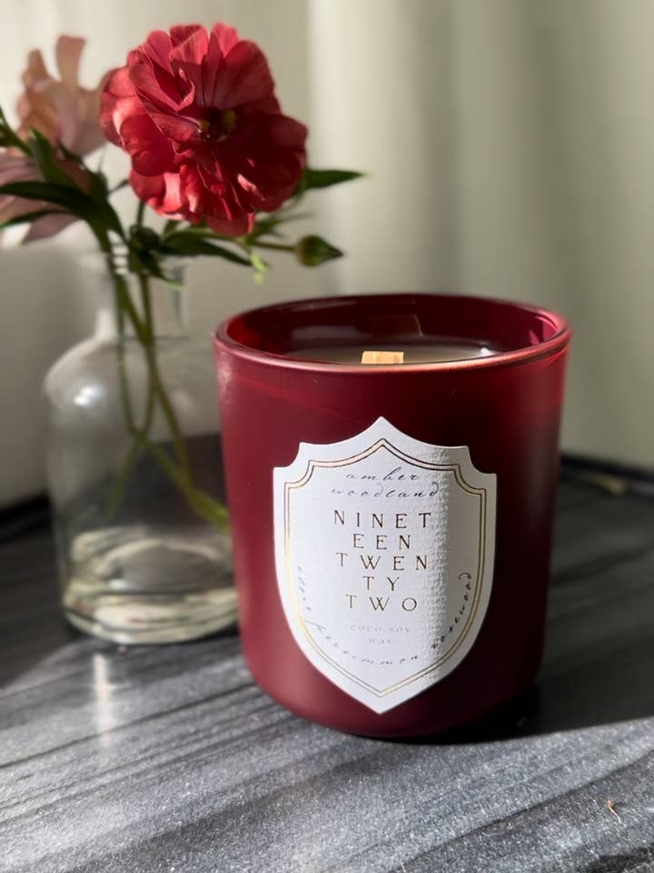 Woody Amber Spice Luxury Candle | Burgundy Glass Jar for wholesale by Nineteen Twenty Two Candle Co.