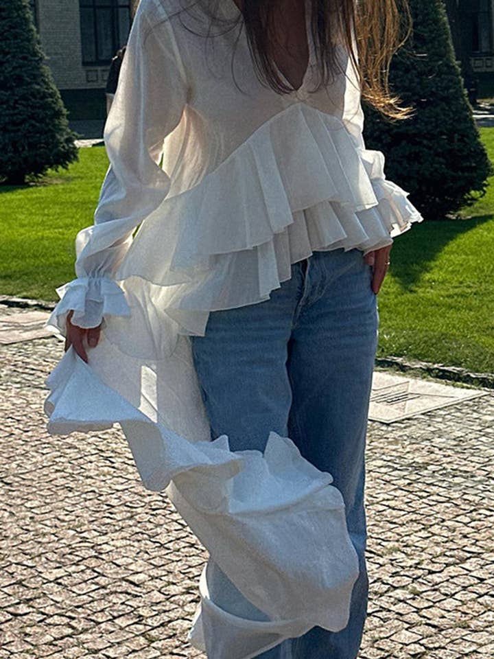 Blus med flödande lager och volanger för wholesale av Mccolin