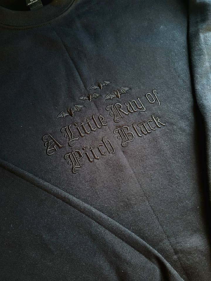 A Little Ray Of Pitch Black Hoodie for wholesale by Cute And Spook