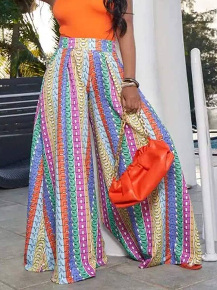 MULTICOLORE pantaloni larghi con dettaglio plissettato stampa lettere allover in vendita all'ingrosso su Faire