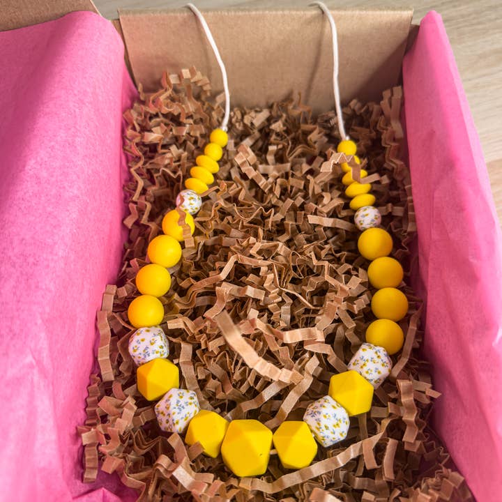 Sonny - Nursing Necklace & Babywearing Necklace βοΈ for wholesale by Bienfaits pour Maman