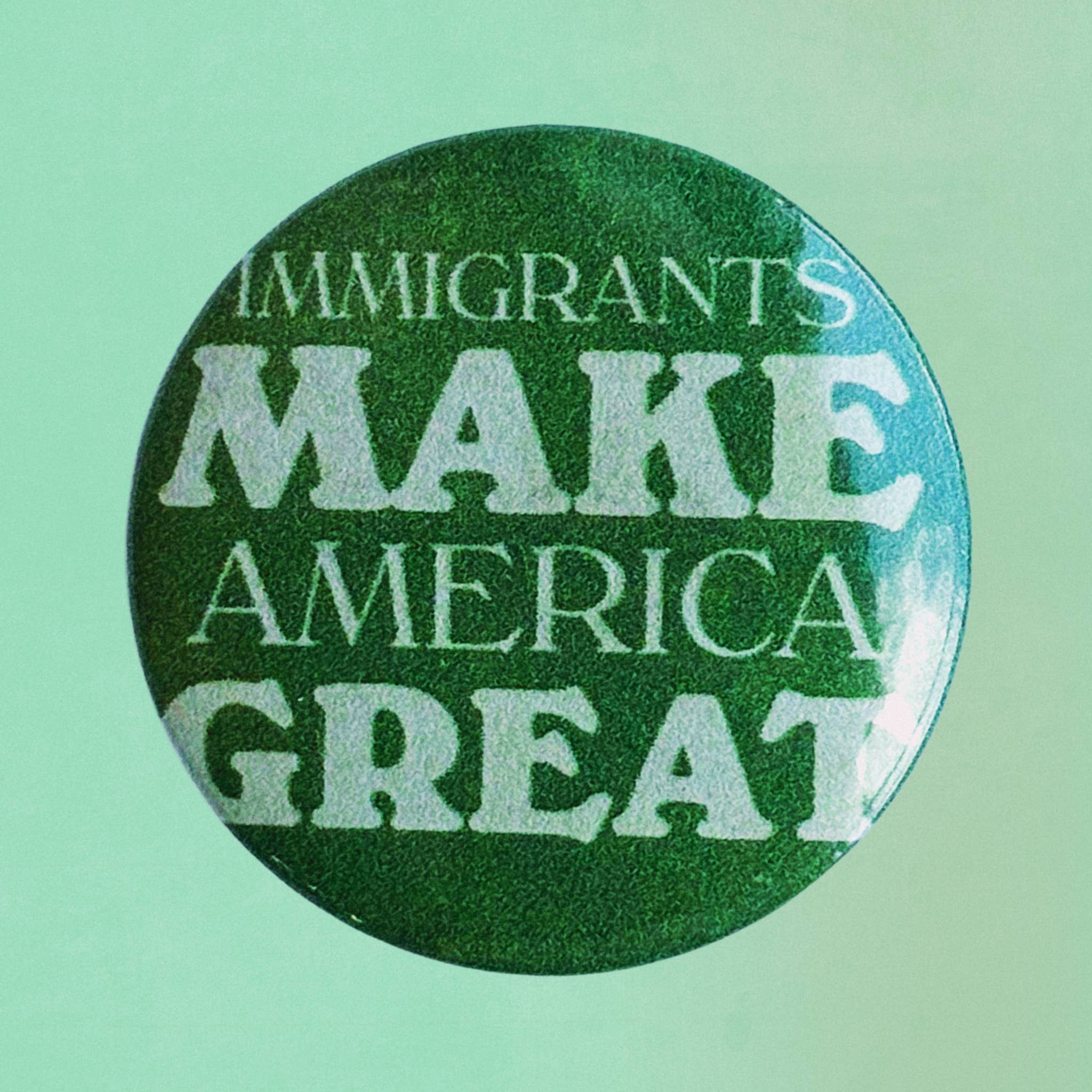 Mistie Eyed Designs - Wholesale Lapel Pin/Button - Immigrants Make America Great Button