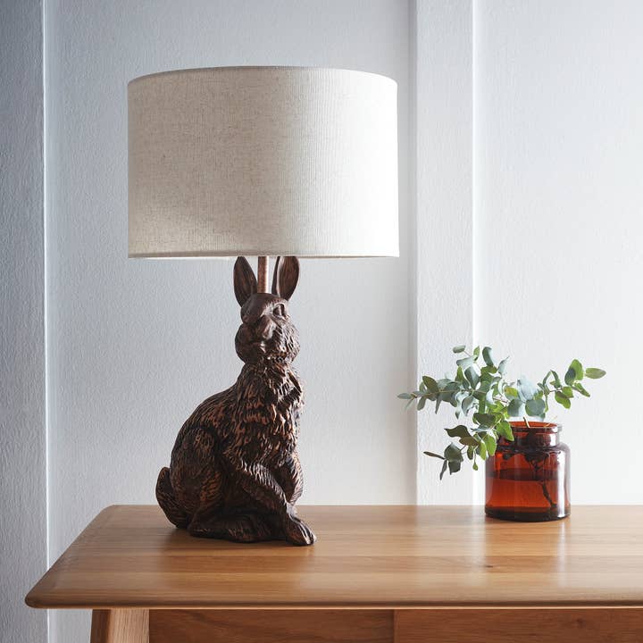 Bunny Rabbit Animal Table Lamp in an Antique Copper Resin Finish with a Natural Linen Lampshade for wholesale by K LIVING