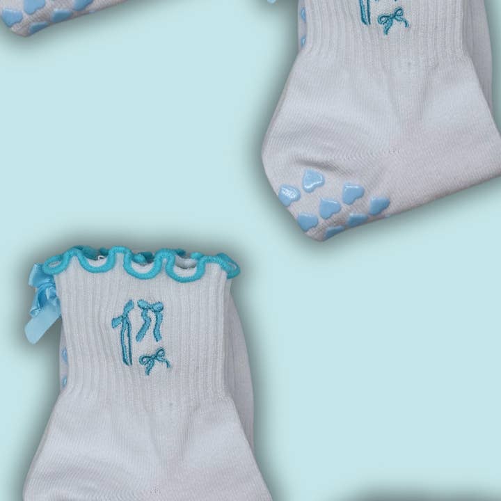 Light blue coquette bow grip sock with heart grips for wholesale by MollyGraceGripSocks