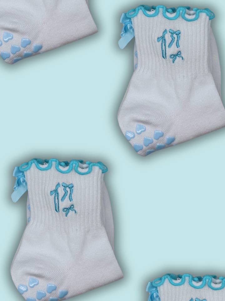 Blue coquette bow grip sock for Pilates, lagree or barre for wholesale by MollyGraceGripSocks