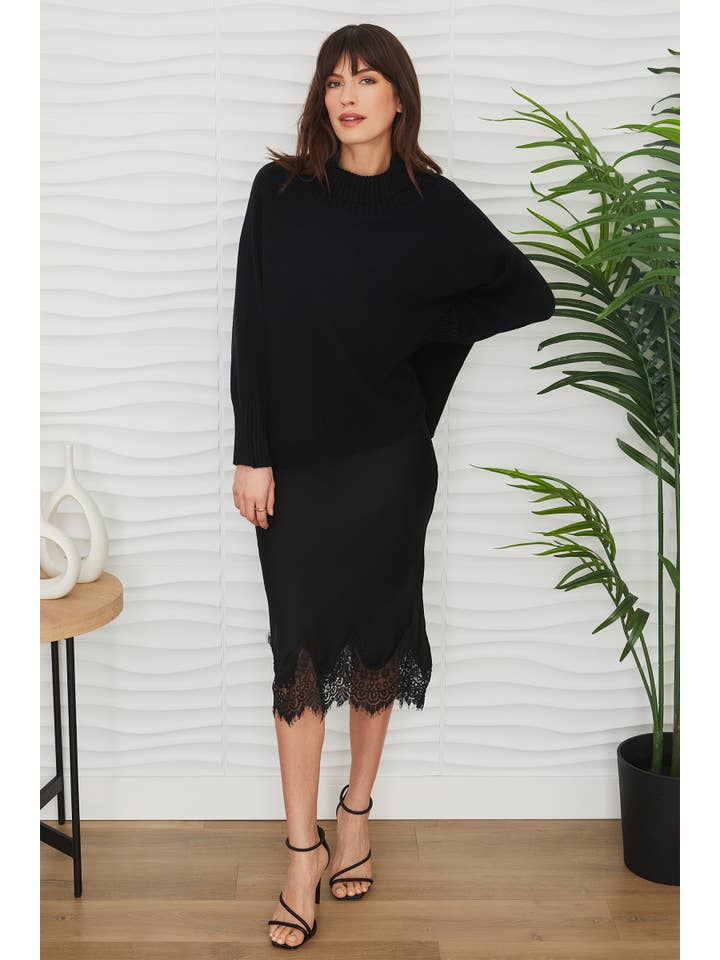 Nero MAGLIONE IN MAGLIA A COLLO ALTO DRAPPEGGIATO (7097-NERO) in vendita all'ingrosso su Faire7