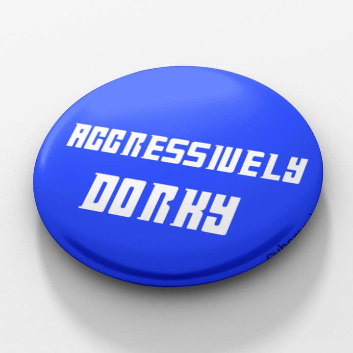 Aggressively Dorky 1.5 inch button for wholesale by Cube Monkey Designs