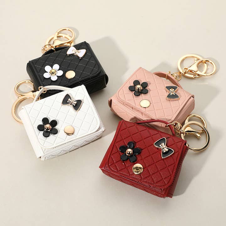 Flower Bow Charm Faux Leather Mini Purse Keychain Bag Charm and other Purchase Wholesale croc charm keychain. Free Returns & Net 60 Terms on Faire trending on Faire.
