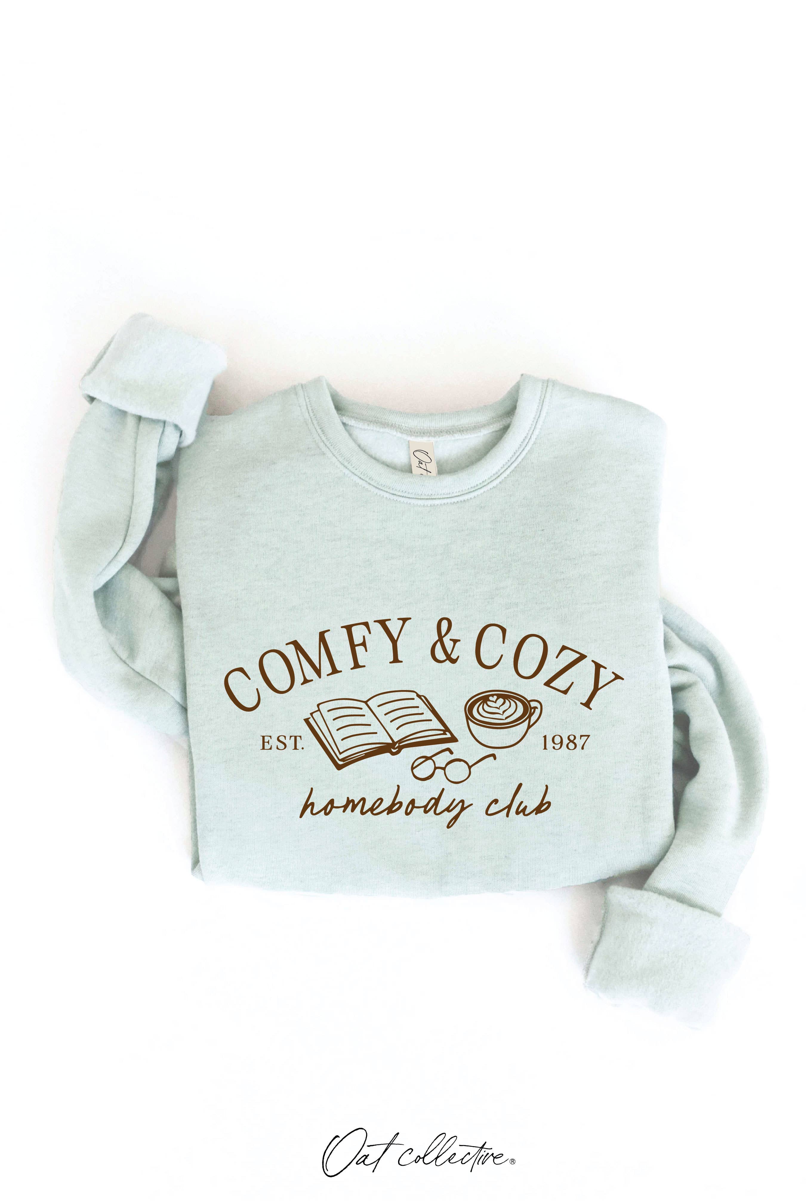 OAT COLLECTIVE – Camisola gráfica - Mulher por atacado – Moletom Gráfico Unissex COMFY AND COZY HOMEBODY CLUB8