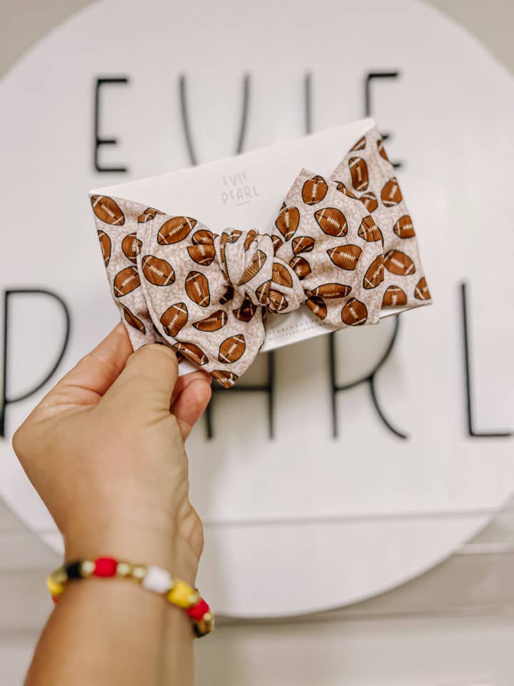 Football Neutral Leopard Baby Bow Turban 6-12m for wholesale by Evie Pearl Handmade LLC