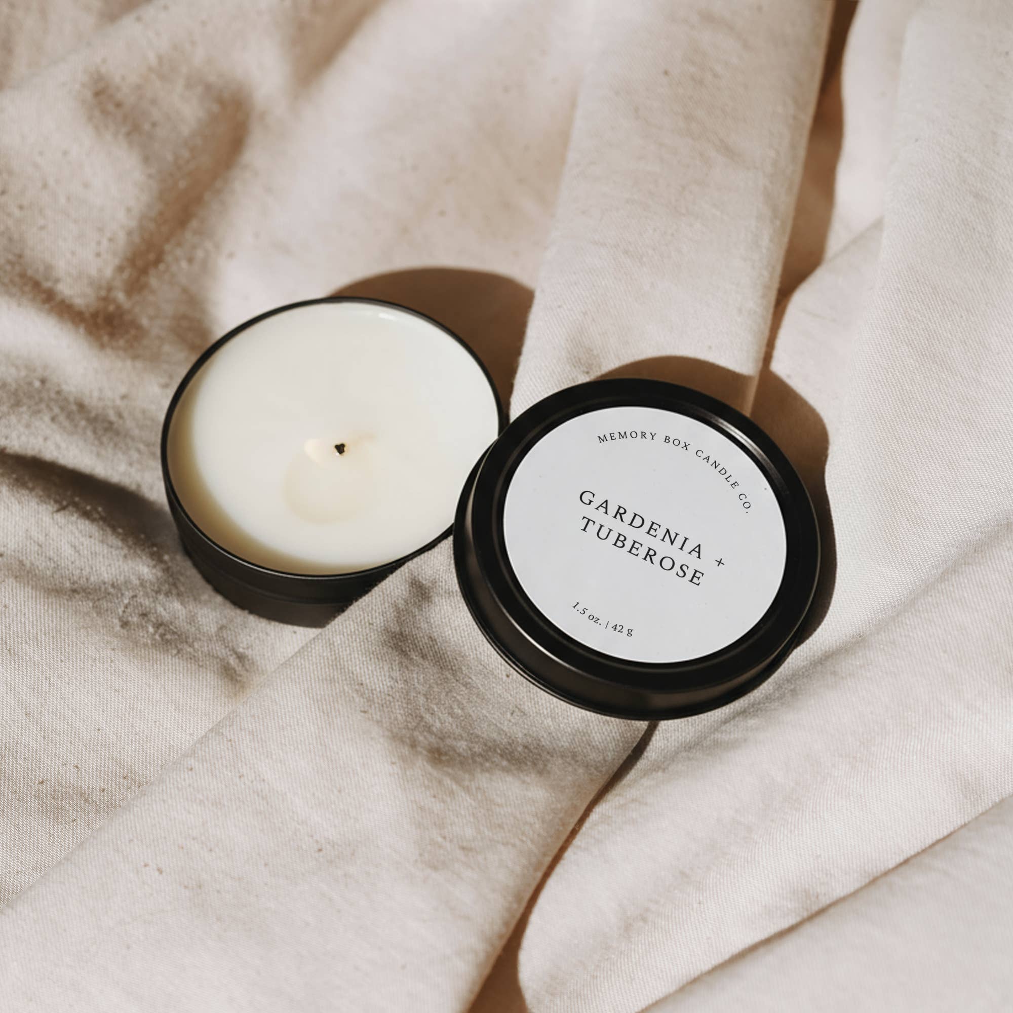 Memory Box Candle Co. - Wholesale Travel Candles - Soy Candle - Gardenia + Tuberose - 1.5 oz Black Travel Tin