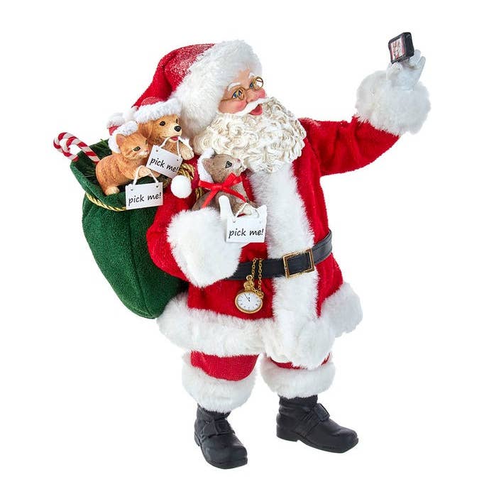 Kurt S. Adler, Inc. - Wholesale Christmas Decoration - 11"Fabriche Santa Taking Selfie