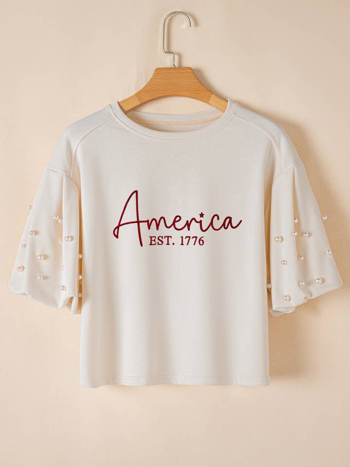 White America EST 1776 Embroidered Pearl Beaded Sleeve T Shirt for wholesale on Faire3