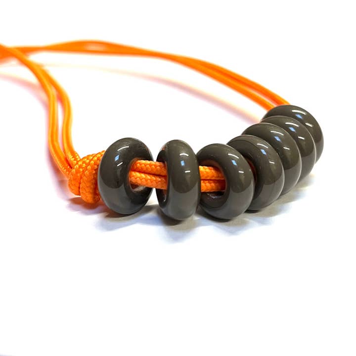 Charcoal on Neon Orange Paracord and Glass Adjustable Necklace for wholesale by Helen Chalmers