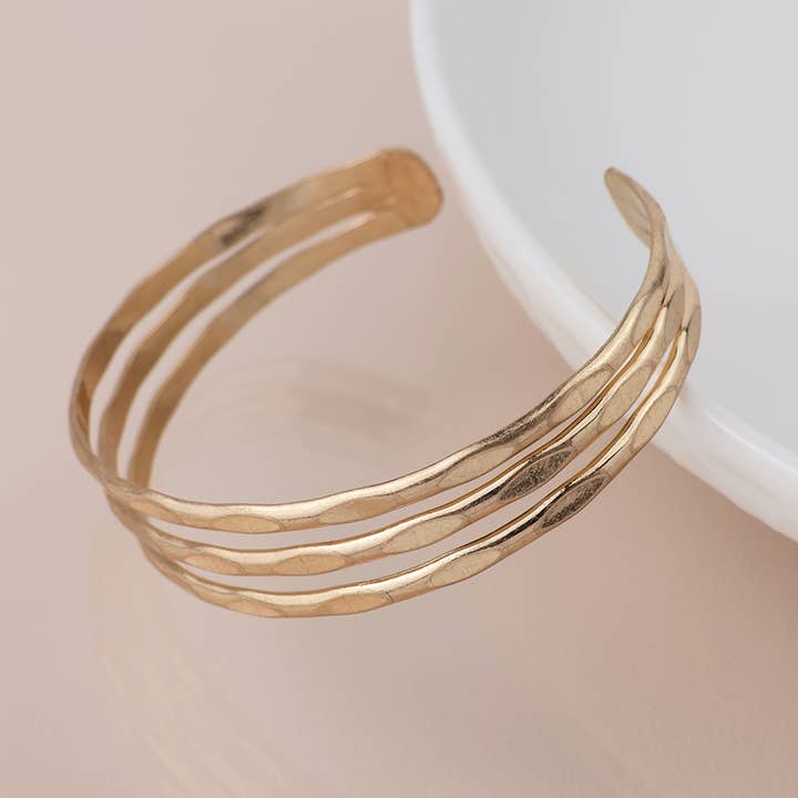 Golden Worn Hammered Triple Strand Bangle for wholesale by Peace Of Mind