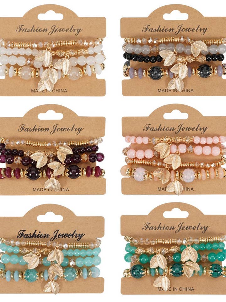 CWMM10456_BRACELET MULTICOUCHE AVEC BRELOQUE FEUILLE BOHO ET PERLES pour la vente par NINEXIS